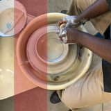 Person working with clay on a potter's wheel