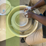 Person working with clay on a pottery wheel, surrounded by green containers.